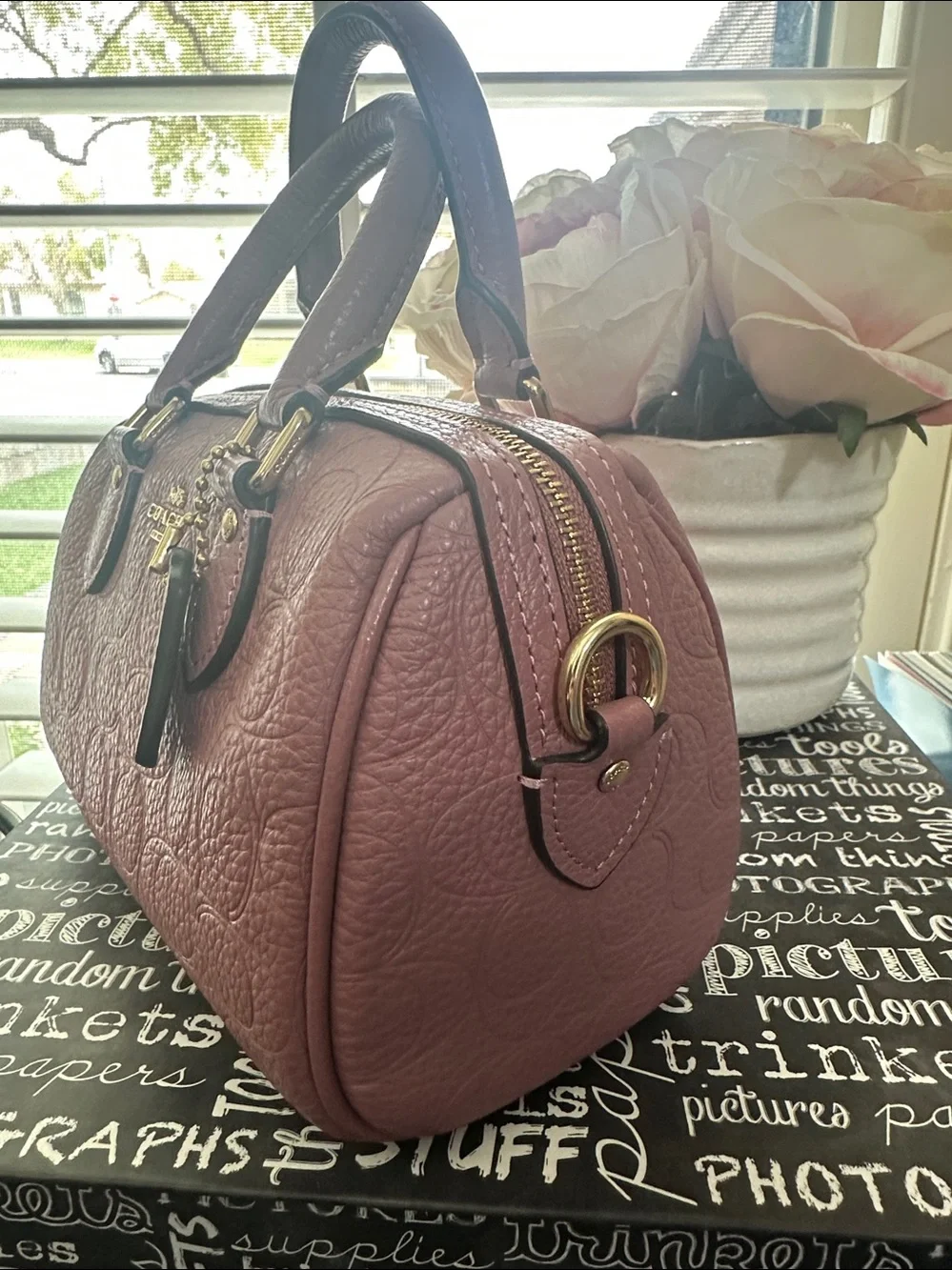 Coach mini Rowan signature leather in the color peony